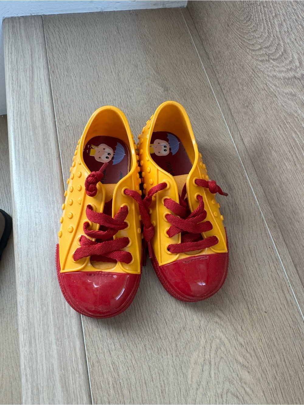 Mini Melissa Yellow Sneakers with Red Laces and Red Toe Caps